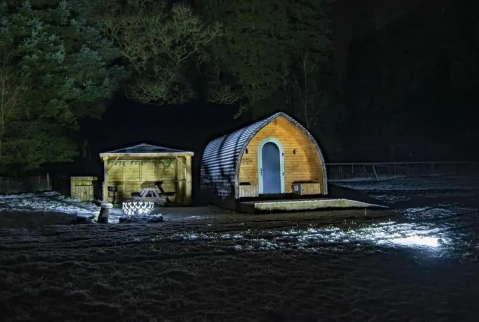 A cabin lit against a frosty night