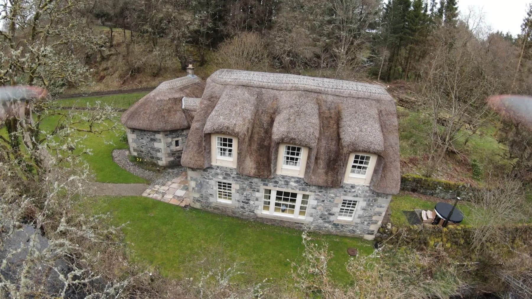 The thatched cottage in the estate woodland